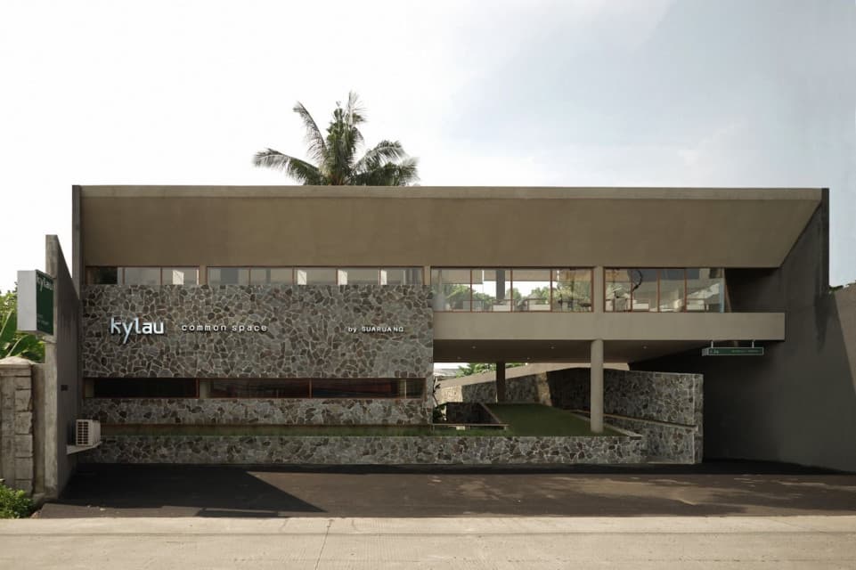 Atmospheric photo of cafe interior with wooden furniture and plants